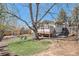 Beautiful backyard with a large deck, tree, shed, and artificial turf for low-maintenance outdoor living at 10858 E Harvard Dr, Aurora, CO 80014