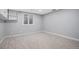 Bedroom with neutral carpet, recessed lighting, and a large window at 10858 E Harvard Dr, Aurora, CO 80014
