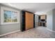 Bedroom with closet, murphy bed, and a view to the outside at 10858 E Harvard Dr, Aurora, CO 80014