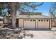 Home exterior with a large driveway and attached two-car garage at 10858 E Harvard Dr, Aurora, CO 80014