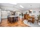 Spacious eat-in kitchen with a large island, stainless steel appliances, and a dining area at 10858 E Harvard Dr, Aurora, CO 80014