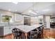 Gourmet kitchen with custom cabinets, stainless steel appliances, and a large center island at 10858 E Harvard Dr, Aurora, CO 80014