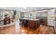 Bright eat-in kitchen with stainless steel appliances, large island, and sliding doors to the outdoors at 10858 E Harvard Dr, Aurora, CO 80014