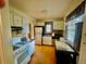 Functional kitchen featuring white cabinets and modern appliances at 1881 S Lincoln St, Denver, CO 80210