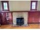 Cozy living room with built-in cabinets surrounding a brick fireplace at 1881 S Lincoln St, Denver, CO 80210