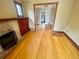Bright living room with hardwood floors and a charming fireplace at 1881 S Lincoln St, Denver, CO 80210