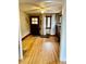 Spacious living room with hardwood floors, ceiling fan, and fireplace at 1881 S Lincoln St, Denver, CO 80210