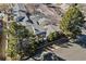 Aerial view of a well-maintained property surrounded by mature trees and a lush green landscape at 7255 S Vine St, Centennial, CO 80122