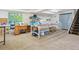 Finished basement space has plenty of room for a craft or hobby area with storage and easy stair access at 7255 S Vine St, Centennial, CO 80122