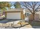 Charming single Gathering home featuring a two-car garage and flag at 7255 S Vine St, Centennial, CO 80122