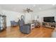Spacious living room featuring hardwood floors, lots of natural light, and ample seating at 7255 S Vine St, Centennial, CO 80122