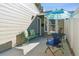 Private patio area with outdoor seating and a colorful umbrella at 7255 S Vine St, Centennial, CO 80122