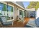 Charming outdoor patio features comfortable seating, a barbeque grill, and sliding door access to the home at 7255 S Vine St, Centennial, CO 80122