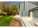 A spacious backyard featuring a well-maintained lawn, stone path and a large deck at 323 S Hoover Ave, Louisville, CO 80027