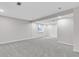Large finished basement with recessed lights and neutral carpet at 323 S Hoover Ave, Louisville, CO 80027