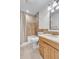 Well-lit bathroom features a shower and tub with a marble vanity at 323 S Hoover Ave, Louisville, CO 80027