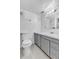 Clean bathroom features a neutral tile floor and a gray vanity at 323 S Hoover Ave, Louisville, CO 80027
