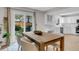 Open concept dining room with backyard view and direct access to kitchen with modern appliances at 323 S Hoover Ave, Louisville, CO 80027