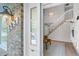 Inviting entryway with view of the staircase, living room, and built in shelving. Lots of natural light at 323 S Hoover Ave, Louisville, CO 80027