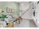 Cozy living room with a comfortable sofa, stylish decor, stairs and built in shelving at 323 S Hoover Ave, Louisville, CO 80027