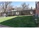 Large backyard featuring well-maintained lawn with privacy fence at 1040 Hemlock Way, Broomfield, CO 80020