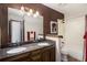 Bathroom with double sinks, granite counters, and shower-tub combination at 1040 Hemlock Way, Broomfield, CO 80020