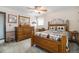 A cozy bedroom featuring wooden furniture, a ceiling fan, and a comfortable quilt-covered bed for a relaxing retreat at 1040 Hemlock Way, Broomfield, CO 80020