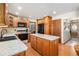 Well-equipped kitchen with an island, modern appliances, and seamless transition to the dining area at 1040 Hemlock Way, Broomfield, CO 80020
