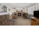 Comfortable living room features a stone fireplace, carpeted floors, and built-in shelving for a cozy and inviting space at 1040 Hemlock Way, Broomfield, CO 80020