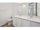 Bright bathroom with double sinks, modern fixtures, and a large mirror at 24747 E 40Th Ave, Aurora, CO 80019