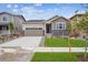 Charming single-Gathering home featuring stone accents, a two-car garage, and a well-manicured lawn at 24747 E 40Th Ave, Aurora, CO 80019