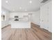 The gourmet kitchen features a large island, stainless appliances, and stylish cabinetry for modern living at 24747 E 40Th Ave, Aurora, CO 80019