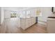The airy kitchen features a large island, stainless appliances, and stylish cabinetry for modern living at 24747 E 40Th Ave, Aurora, CO 80019