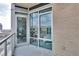 Condo balcony featuring floor-to-ceiling windows, a glass door, and stunning city views at 4200 W 17Th Ave # 619, Denver, CO 80204