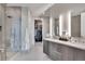 Bathroom featuring double vanity, shower and soaking tub, and a walk-in closet at 4200 W 17Th Ave # 619, Denver, CO 80204