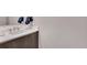 Modern bathroom vanity with sleek fixtures, white countertop, and a decorative floral accent at 4200 W 17Th Ave # 619, Denver, CO 80204