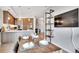 Modern kitchen and dining area showcasing stainless appliances, island seating, and open layout at 4200 W 17Th Ave # 619, Denver, CO 80204