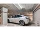 Parking spot with an electric car plugged into a charging station within the parking garage at 4200 W 17Th Ave # 619, Denver, CO 80204