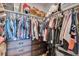 Spacious walk-in closet with custom shelving, plenty of hanging space, and drawer storage at 4200 W 17Th Ave # 619, Denver, CO 80204