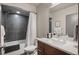 Modern bathroom with tiled shower, soaking tub, and vanity with sink at 47 Harrison, Denver, CO 80206