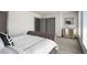 Comfortable bedroom showcasing a large bed, dresser, soft carpet, and a window with coverings at 47 Harrison, Denver, CO 80206