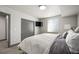 Neutral bedroom with closet, flatscreen TV, and bright window at 47 Harrison, Denver, CO 80206