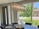 Dining area with stylish light fixture, round table, and view of the outdoors at 47 Harrison, Denver, CO 80206