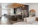 Open-concept kitchen with stainless steel appliances, stylish lighting, and wood ceiling at 47 Harrison, Denver, CO 80206