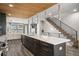 Spacious kitchen island with seating, stainless appliances, and hardwood floors at 47 Harrison, Denver, CO 80206
