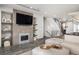 Modern living room features an electric fireplace and a large TV at 47 Harrison, Denver, CO 80206