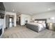 A spacious bedroom featuring a large bed, walk-in closet, and en-suite bathroom access at 47 Harrison, Denver, CO 80206