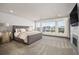 Open main bedroom with a large bed, windows with a city view, and modern furnishings at 47 Harrison, Denver, CO 80206