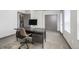 Well-lit office with a modern desk, comfortable chair, and large windows at 47 Harrison, Denver, CO 80206
