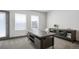 Bright office with a large desk, storage cabinet, and bright natural light at 47 Harrison, Denver, CO 80206